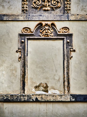 Baroque frame on a wall of a typical European building.