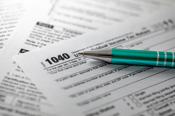 annual tax form 1040 and pen