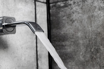The water tap with water stream and drops. Faucet for the bathroom and kitchen mixer. Modern faucet...