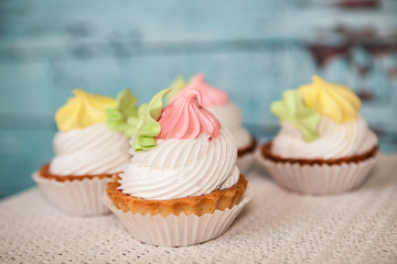 Pink and yellow sweet dessert on blue background