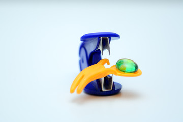 Inside the stepler remove lies a silicone toy in the shape of a man.