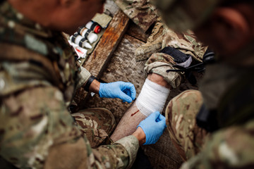 soldiers with weapons during the rescue operation. war, army, technology and people concept...