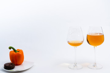 Alcoholic drinks such as wine or beer and variable colorful side dish such as vegetables or fruites surrounded clean white wall for the celebration of anniversary day.