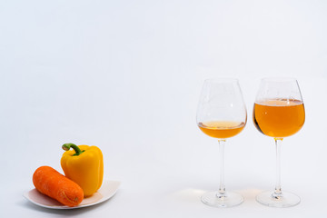 Alcoholic drinks such as wine or beer and variable colorful side dish such as vegetables or fruites surrounded clean white wall for the celebration of anniversary day.