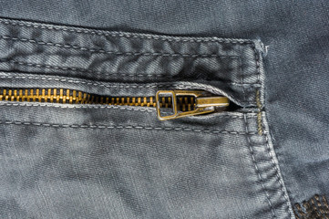 clothing items washed cotton fabric texture with seams, clasps, buttons and rivets