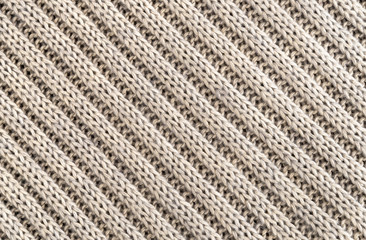 Background of Handmade Knitted fabric of wool Cream color, cloth knitted texture.