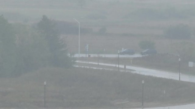 Rainy Day With Cars Driving In Distance