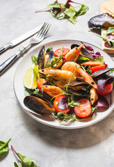 Seafood salad, mussels, shrimp, fresh vegetables and herbs.