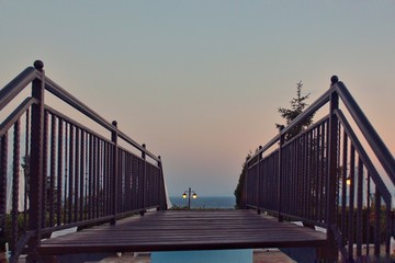 Wooden bridge at the sunset