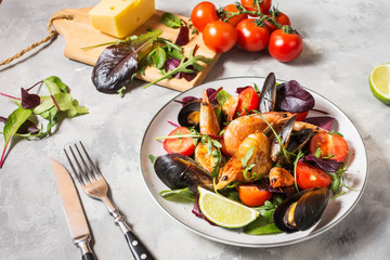 Seafood salad, mussels, shrimp, fresh vegetables and herbs.