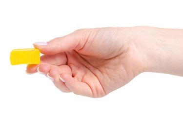 Jelly candies in hand on white background isolation