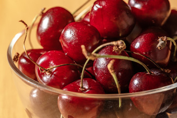 Sweet cherry (black cherry) close-up in a glass tumbler