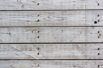 Naklejka premium texture of the painted shabby wooden flooring made of boards, grunge background