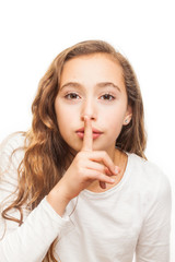 Naklejka premium Young girl with holding finger on her lips on silence gesture isolated on white background