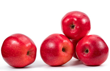 Red apples over white background