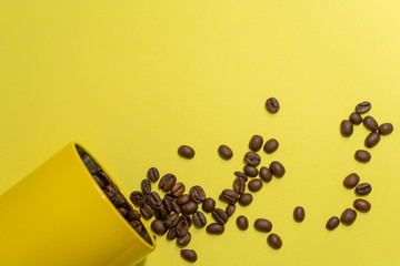 Close-up of coffee beans scattered from the can
