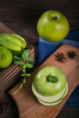 Set of green fruits for healthy diet and detox: apple, lime, kiwi, mango, carambola and mint.