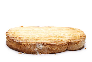 Fried whole wheat toast bread slices isolated on white background
