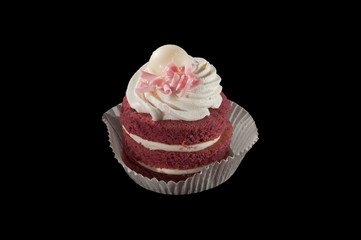 Three layer mini cake isolated on a black background