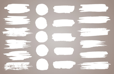 Set of white ink vector stains. Vector black paint, ink brush stroke, brush, line or round texture. Dirty artistic design element, box, frame or background for text.
