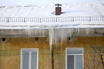 Large icicles hanging from the roof