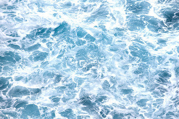 Fototapeta na wymiar Sea waves with foam, top view, background