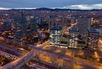 Naklejka na ściany i meble Barcelona cityscape in evening with a modern apartment buildings