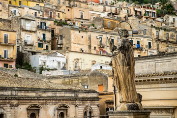 Fototapeta na wymiar Back view of statue outside the Duomo of Saint Peter san pietro, Modica, Sicily