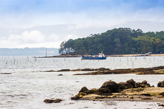 Sand dredge ship anchored in front of Cortegada Island