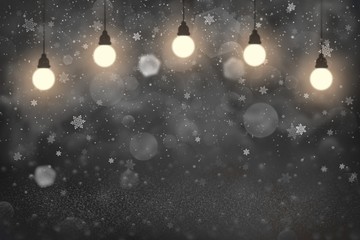 cute bright glitter lights defocused bokeh abstract background with light bulbs and falling snow flakes fly, holiday mockup texture with blank space for your content