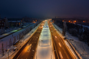 Aerial view of night highway in winter