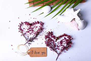 An arrangement for luxury wellness gift ideas and cards with a tag saying "I love you"