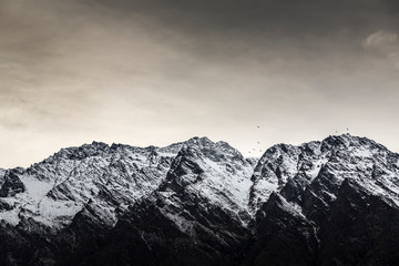 Birds fly near the Remarkables, Queenstown