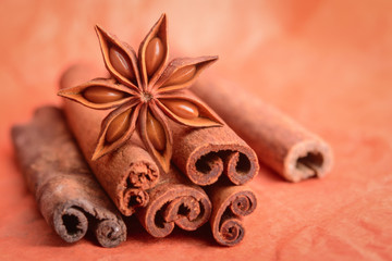 Anise stars with cinnamon on wooden background - Image