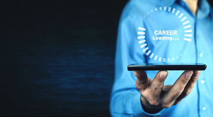 Man holding phone with Career Loading symbol.