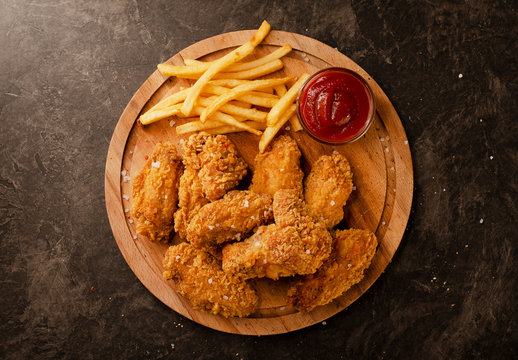 Fried in breaded chicken wings and french fries