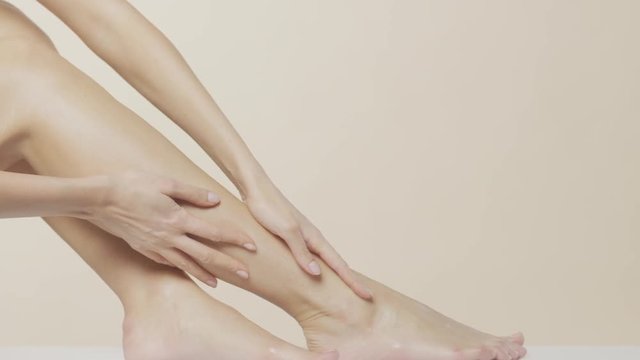 Beautiful female hands massaging legs and feet, recorded at Red Monstro using the light Briese HMI Focus 140.