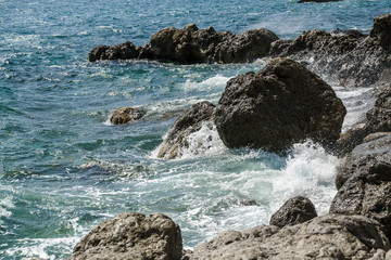 waves crashing on rocks