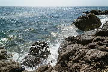 waves crashing on rocks