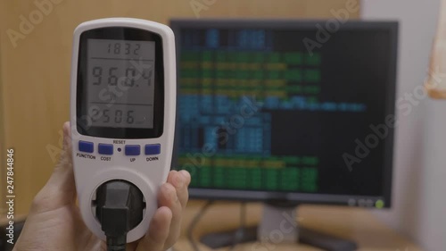 Closeup Of Power Meter Tool Held By A Young Technician Showing - 