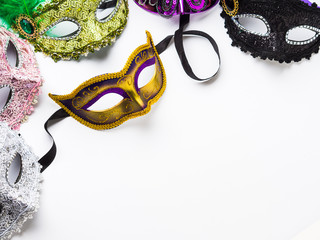 Colorful carnival masks on white background