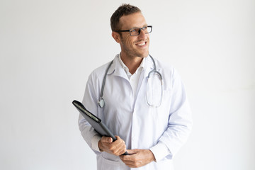 Cheerful ambitious doctor in glasses holding folder