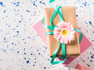 Fototapeta na wymiar Stacked gift boxes with flowers. Pastel colors