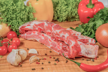 Juicy raw meat, beef entrecote on black background, top view