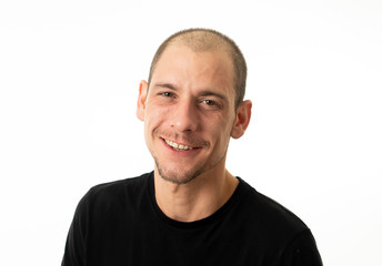 Obraz premium Close up portrait of smiling attractive young man with happy face looking at the camera
