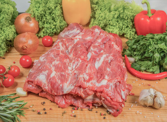 Juicy raw meat, beef entrecote on black background, top view