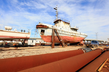 Fototapeta premium ship in repair，in a shipyard, Tangshan City, Hebei, China