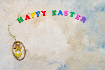 Easter background. Easter decoration and colorful letters forming words HAPPY EASTER. Copy space for your text.