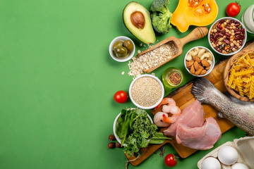 Mediterranean diet concept - meat, fish, fruits and vegetables on bright green background - obrazy, fototapety, plakaty