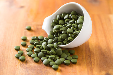 Green chlorella pills or green barley pills.